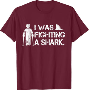 I Was Fighting A Shark Foot Surgery Funny Broken Leg Story T-Shirt - T-Shirt | Maroon