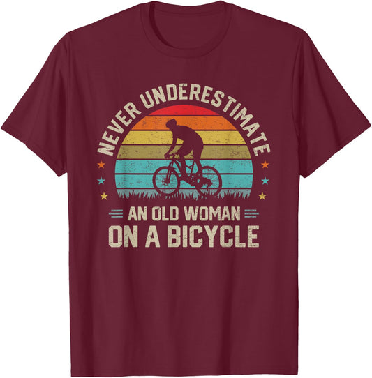 Never Underestimate an Old Woman on a Bicycle Cyclist Rider T-Shirt - T-Shirt | Maroon
