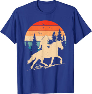 Bigfoot Riding Unicorn! Funny Sasquatch Unicorn Retro Sunset T-Shirt - T-Shirt | Royal