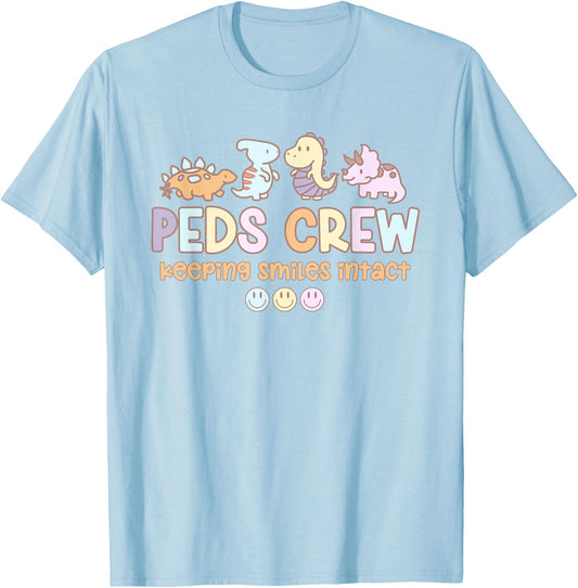 Groovy Peds Team Crew Keeping Smiles Intact Pediatric Nurse T-Shirt - T-Shirt | Light Blue