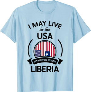 May Live In The USA But My Story Began In Liberia Flag Gift T-Shirt - T-Shirt | Light Blue