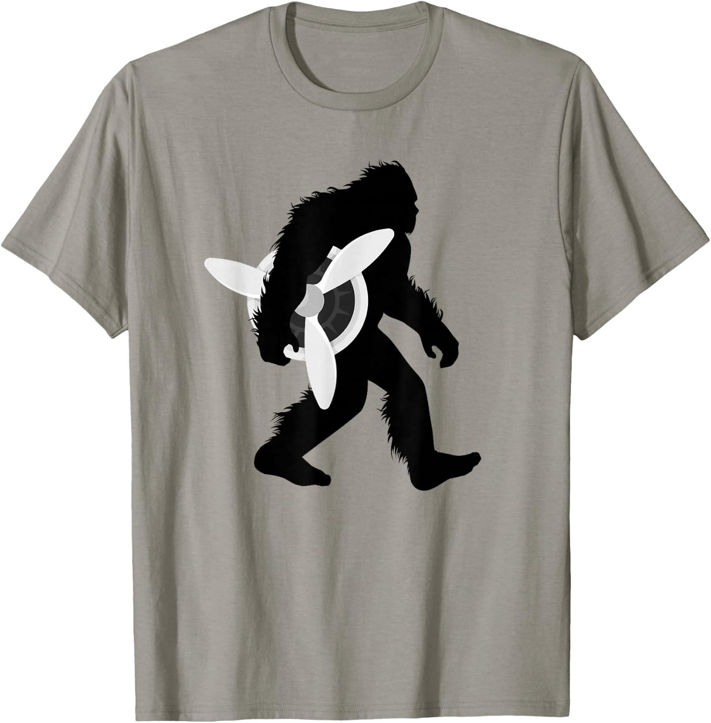 Bigfoot Carrying Airplane Propeller Sasquatch Pilot T-Shirt - T-Shirt | Sand
